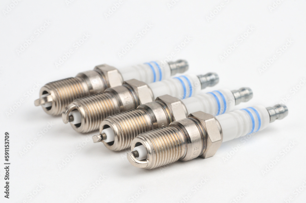 Car spark plug on isolated white background Car spark plug on isolated white background