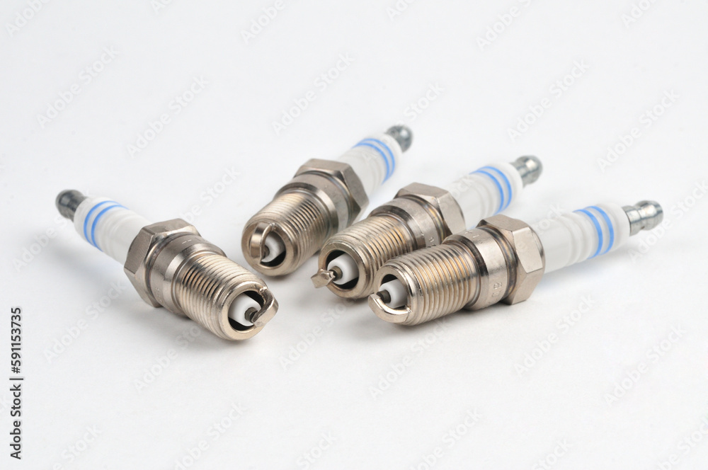Car spark plug on isolated white background Car spark plug on isolated white background