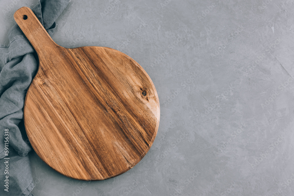 Chopping board. Empty round wooden cutting board with napkin Chopping board. Empty round wooden cutting board with napkin