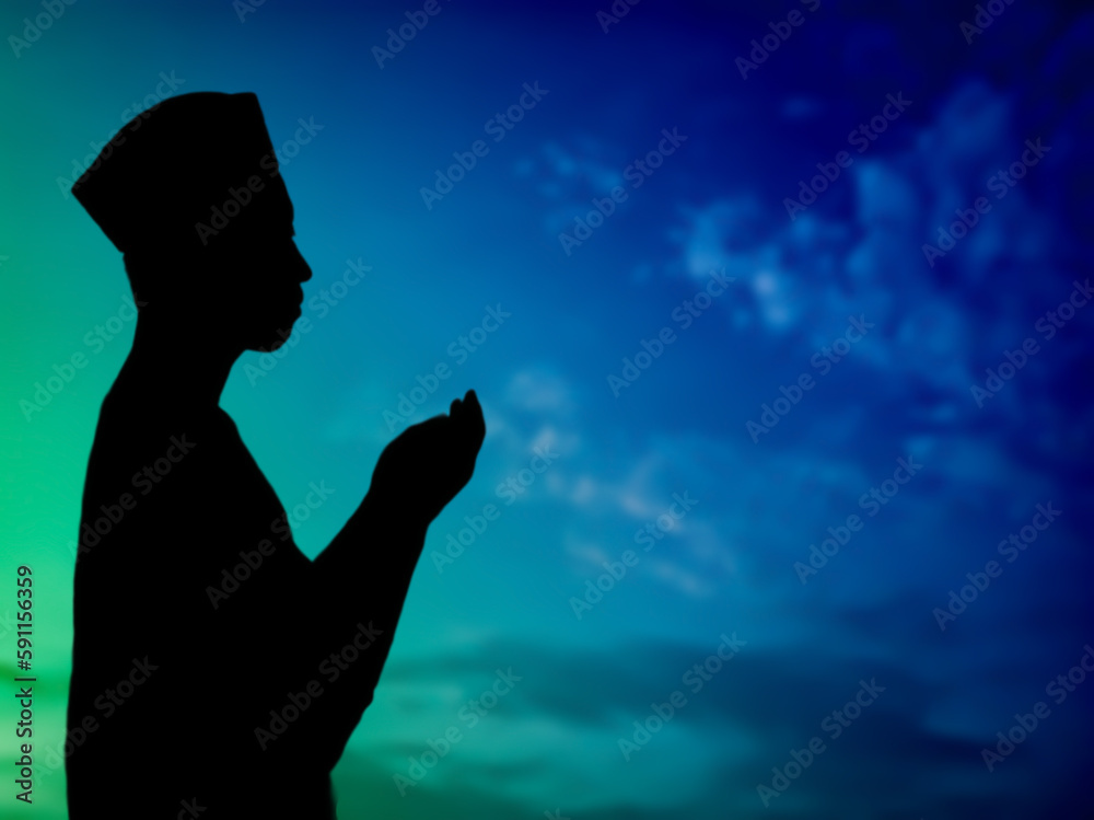 silhouette concept of muslim man praying to allah on hill. with a beautiful natural sunset panorama. focus on people silhouette concept of muslim man praying to allah on hill. with a beautiful natural sunset panorama. focus on people