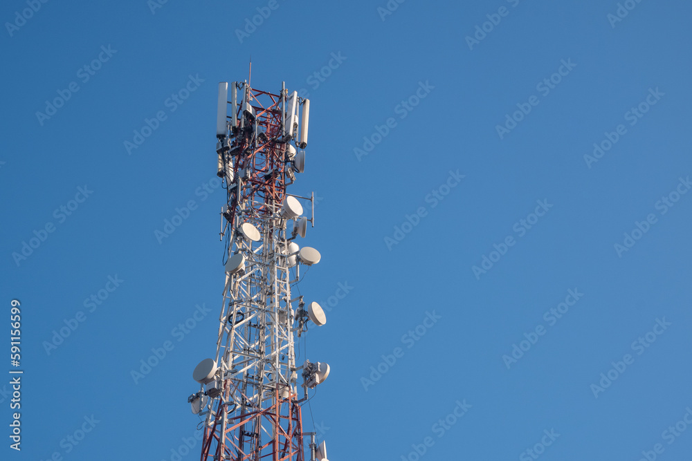 Telecommunications tower with a clear blue sky background Telecommunications tower with a clear blue sky background