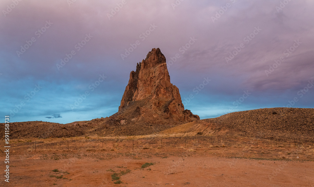 Arizona's Kayenta-Monument Valley Scenic Road through the Navajo reservation. An impressive rock formation known as El Capitan, or Agathla Peak, near the entrance of Monument Valley.