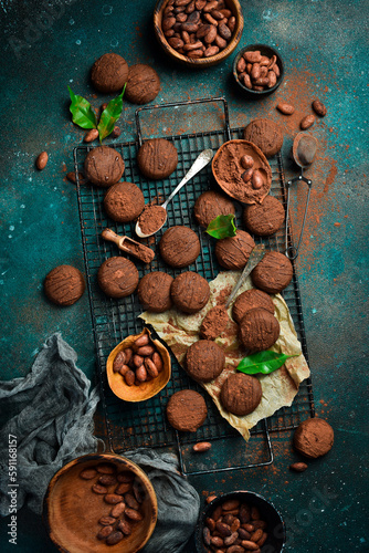 Truffle with cocoa and chocolate. On a dark background. Top view.