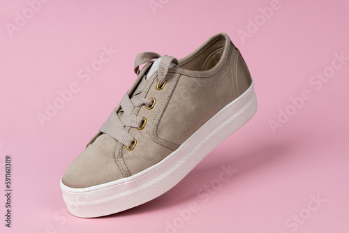 Female elegant, casual shoe. Pink background. Fashion