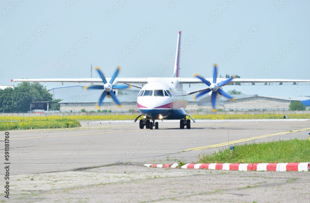 Turboprop passenger aircraft on the runway Turboprop passenger aircraft on the runway