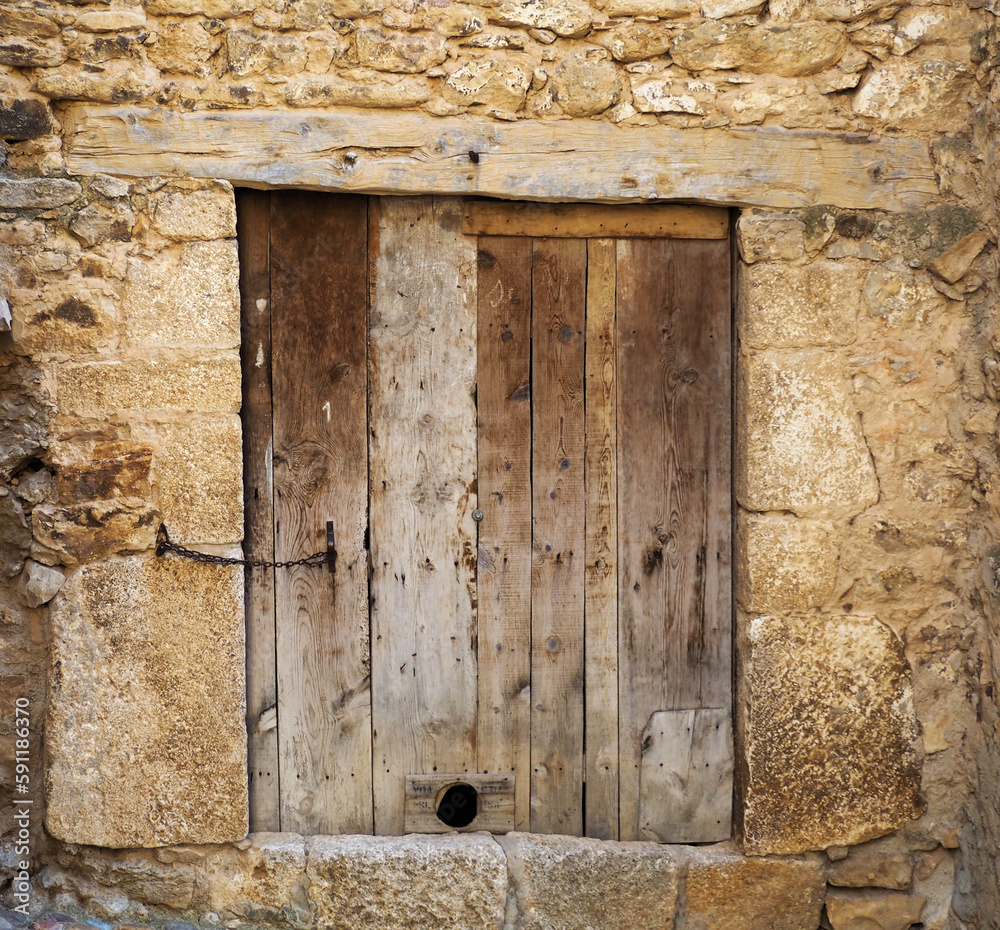 Old door in an abandoned house in a village
