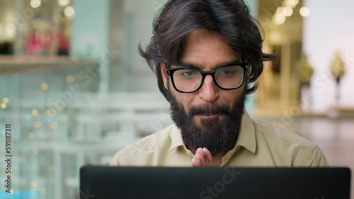 Portrait smiling happy business owner Indian Arabian man Muslim worker user male businessman executive salesman with laptop smile wave nod head yes satisfied with online result working with computer
