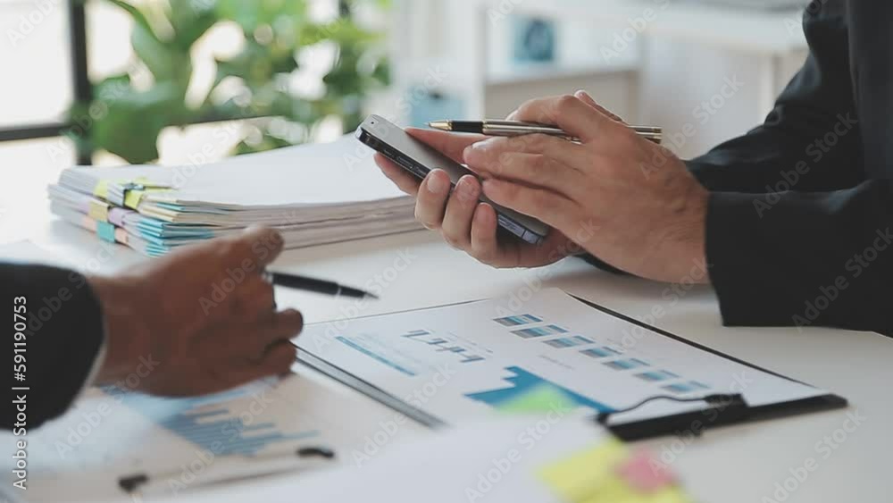 Financial analysts analyze business financial reports on a digital tablet planning investment project during a discussion at a meeting of corporate showing the results of their successful teamwork. Financial analysts analyze business financial reports on a digital tablet planning investment project during a discussion at a meeting of corporate showing the results of their successful teamwork.