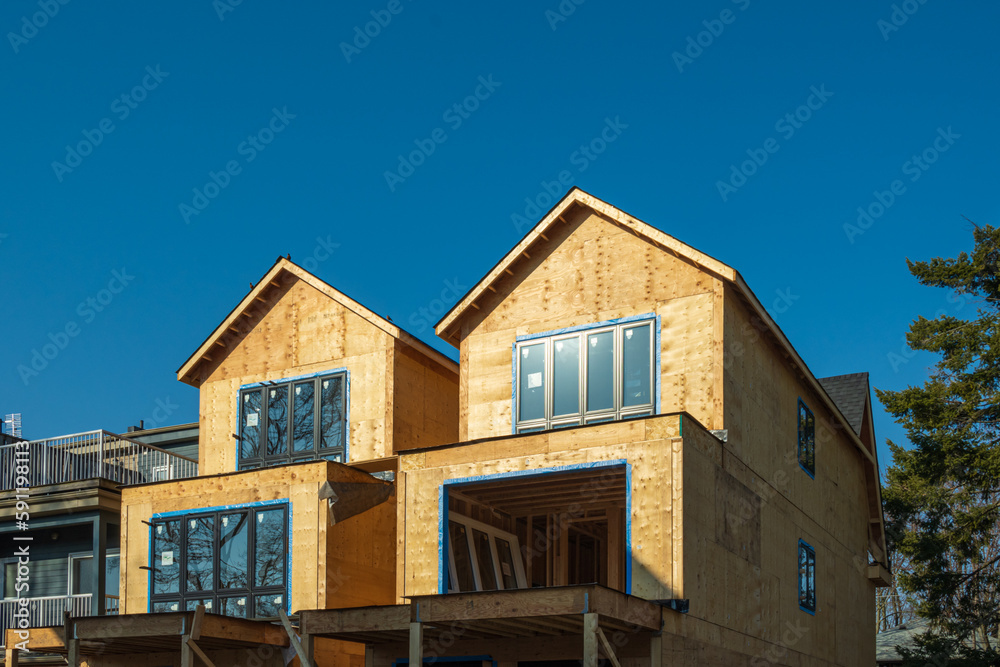 in construction  wood frame houses with windows 
