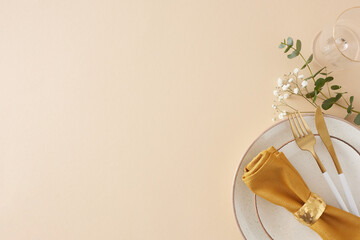 Table setting concept. Top view photo of circle plate cutlery knife fork napkin with ring empty glass eucalyptus leaves and gypsophila flowers on pastel beige background with empty space