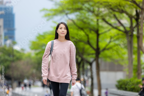 Woman walk in the street © leungchopan