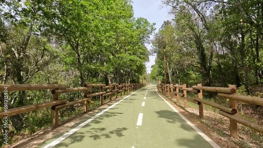 Point of view shot of riding a bicycle in Vouzela, Portugal. Features a wide view of the bike track and the natural scenery. Point of view shot of riding a bicycle in Vouzela, Portugal. Features a wide view of the bike track and the natural scenery.