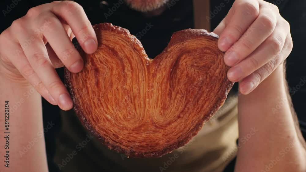 Spanish dessert palmera from local bakery, palmerita - sweet dry crunchy puff pastry biscuit.