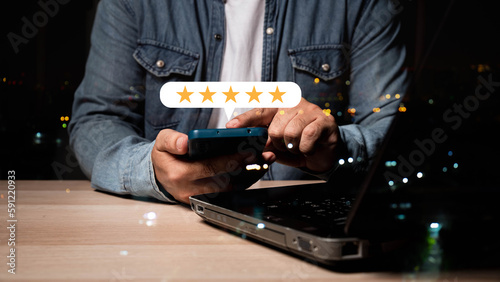 businessman hand give five star on virtual screen to give satisfaction in service. rating very impressed , Customer service and Satisfaction concept