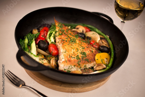 Kalkan fish in a frying pan.