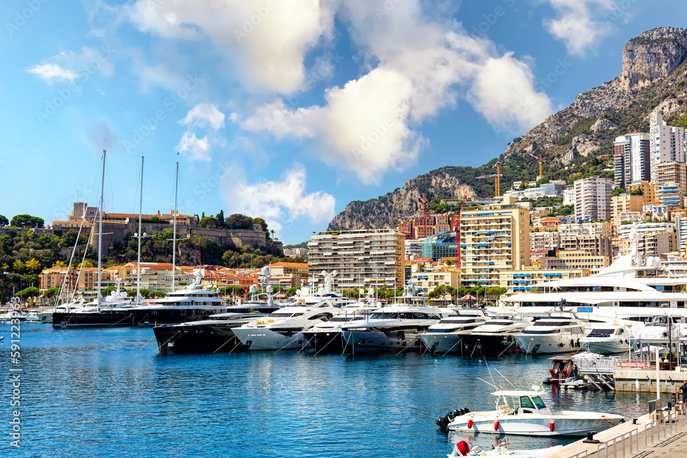 Monaco port, Monte Carlo. Coastal view with luxury yachts and boats. Panoramic view. Summer time, 2022.