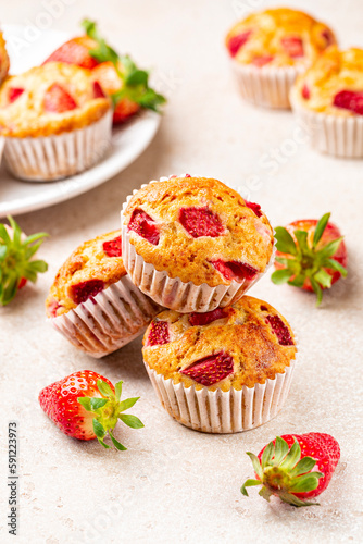 Strawberry banana muffins. Fruit homemade sweet pastry. Selective focus, vertical image.