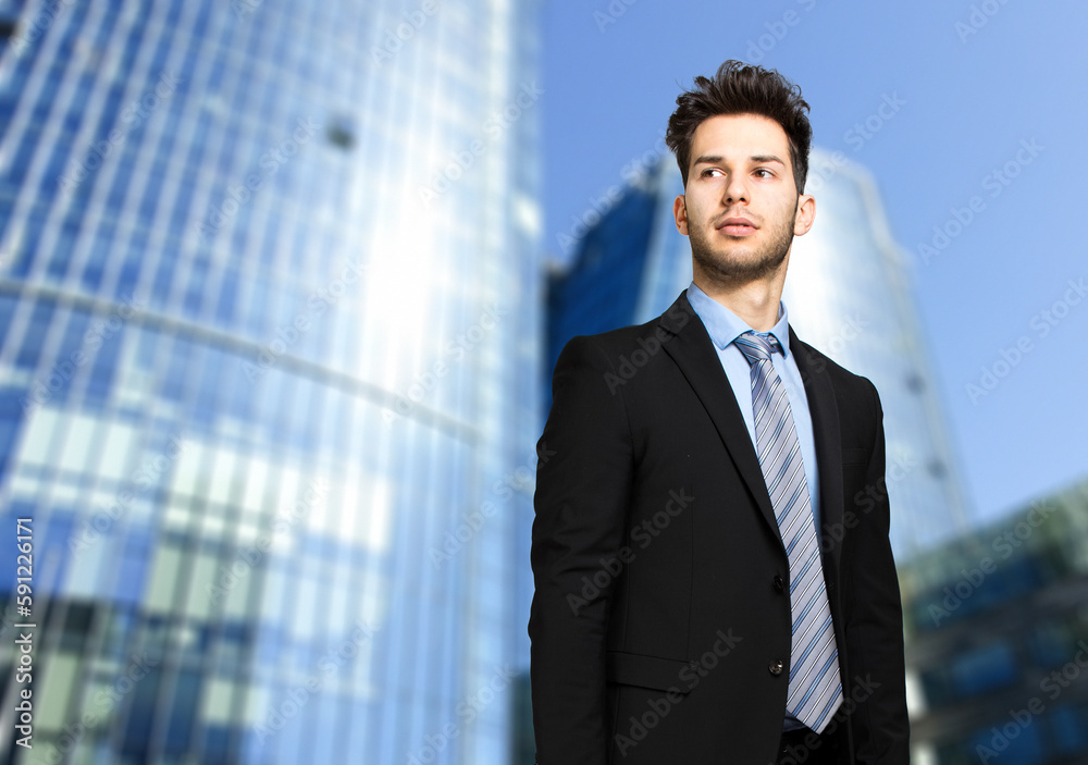 Handsome businessman outdoor in a modern urban setting Handsome businessman outdoor in a modern urban setting