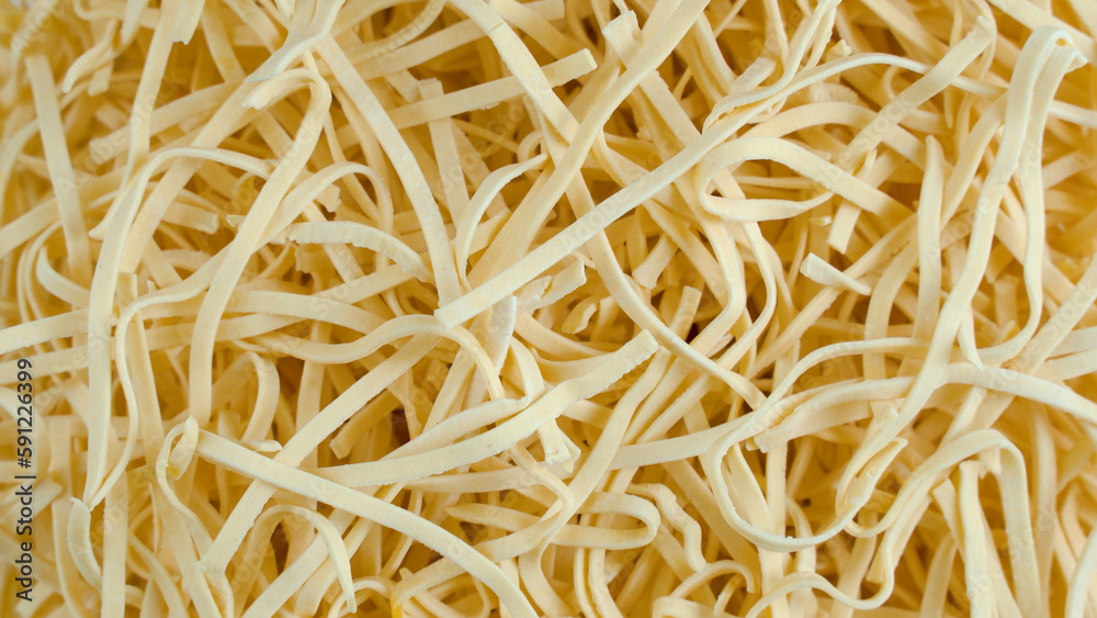 close up of spaghetti. Yellow semi-finished pasta close up of spaghetti. Yellow semi-finished pasta