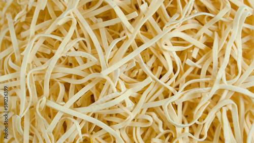 close up of spaghetti. Yellow semi-finished pasta
