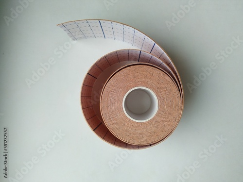 kinesiology tape on white background. Physiotherapy and therapeutic tape for wrist pain, aches and tension. elastic therapeutic tape. adhesive tape and alternative medicine

