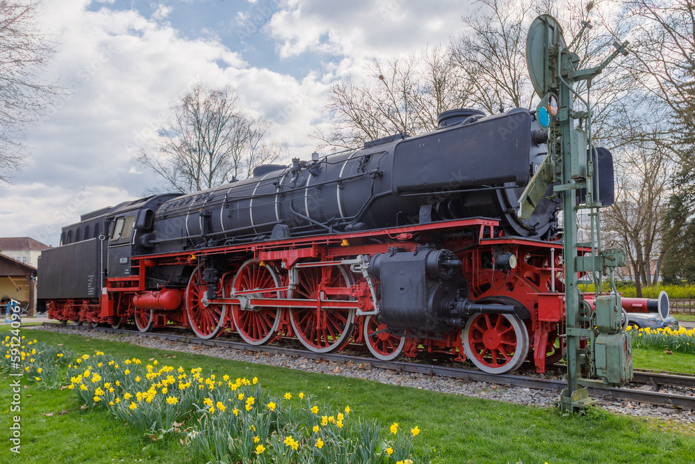Naklejka premium Steam locomotive in Treuchtlingen. The express locomotive 01 220 as a monument in Treuchtlingen. The locomotive is registered as a monument in the Bavarian monument list.