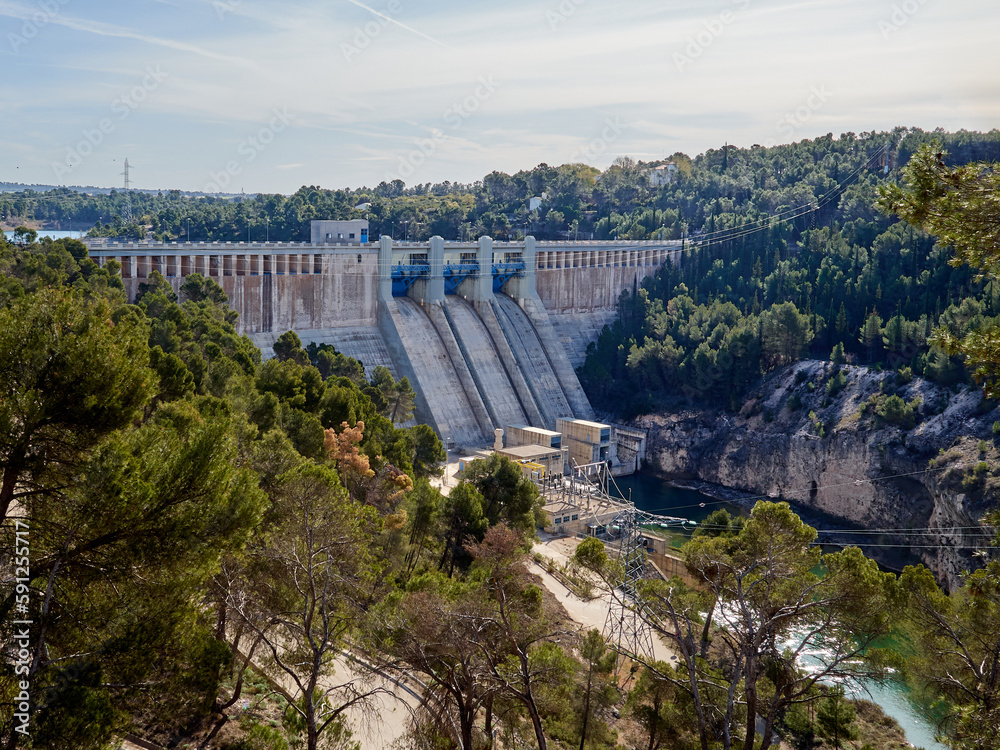Gravity dam in Alarcon, in the course of Jucar river. Cuenca, Castilla La Mancha, Spain. The reservoir is called Embalse or Pantano de Alarcón in Spanish. Electricity generation, renewable energy