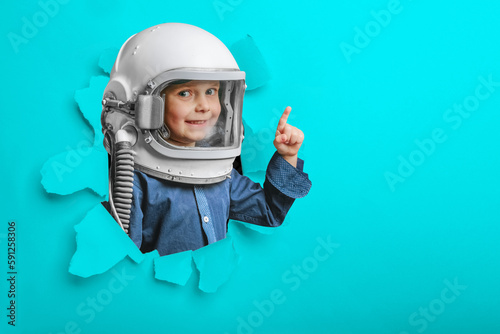 small child imagines himself to be an astronaut