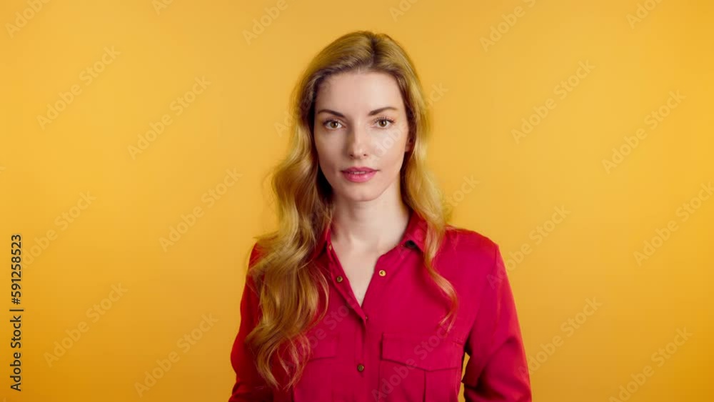 Surprised young woman hands up wonder, shocked. Wow! Blonde lady amazed excited by success, win, surprise emotion. Oh my god expression! Indoor studio shot isolated on yellow background Surprised young woman hands up wonder, shocked. Wow! Blonde lady amazed excited by success, win, surprise emotion. Oh my god expression! Indoor studio shot isolated on yellow background