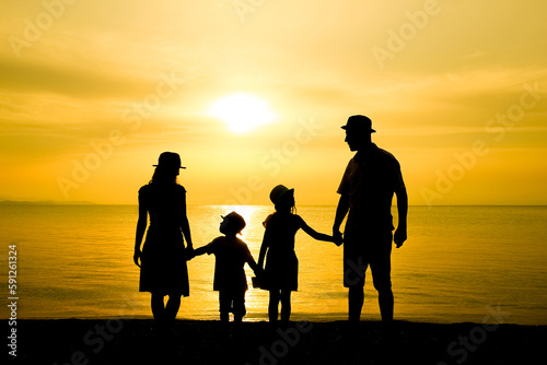 A happy family in nature by the sea on a trip silhouette © Kostia