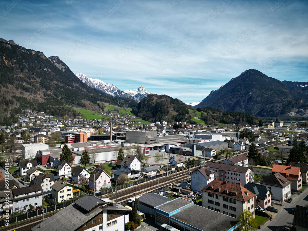 Fototapeta premium view of the city of Bludenz from the air, alpine landscape, spring