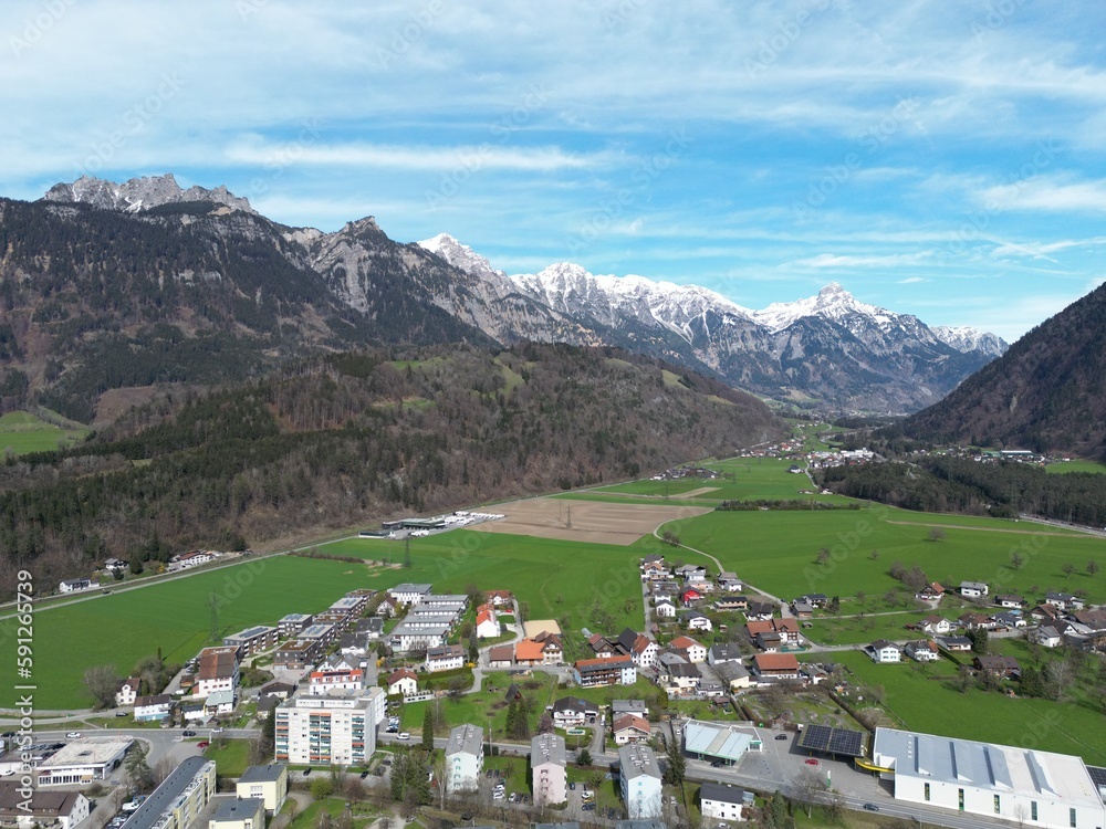 view of the city of Bludenz from the air, alpine landscape, spring