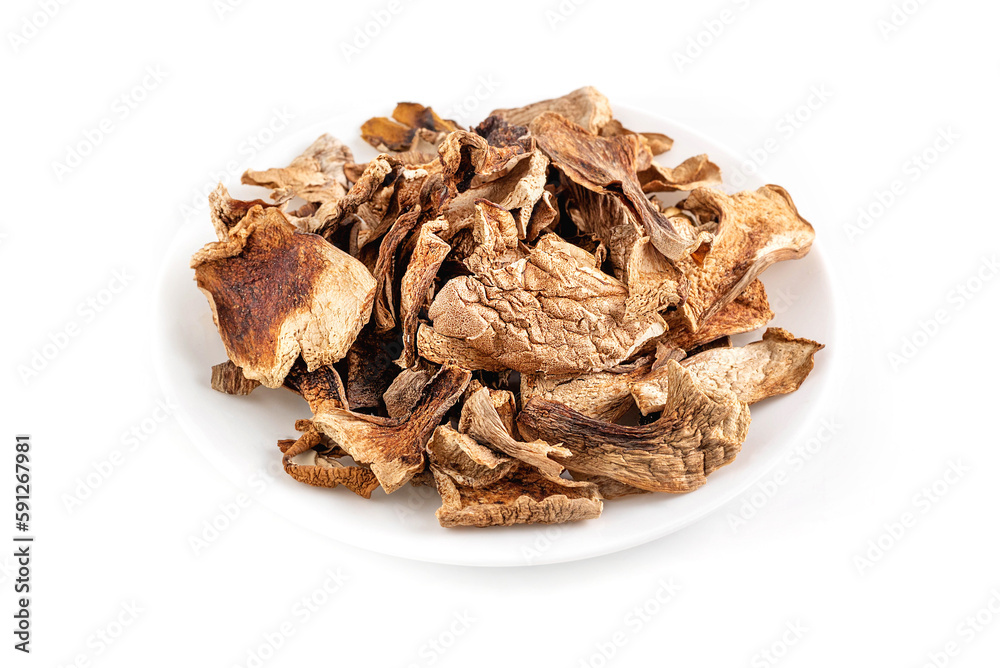On a white background a plate with dried mushrooms. On a white background a plate with dried mushrooms.