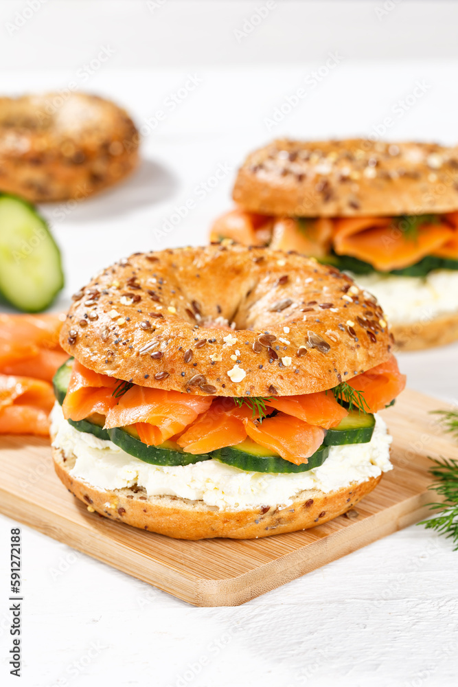 Bagel sandwich with salmon and cream cheese for breakfast portrait format Bagel sandwich with salmon and cream cheese for breakfast portrait format