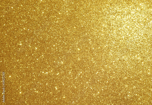 Golden shiny glitter background. Metallic glowing background. 