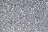 Silver shiny glitter background. Metallic glowing background.
