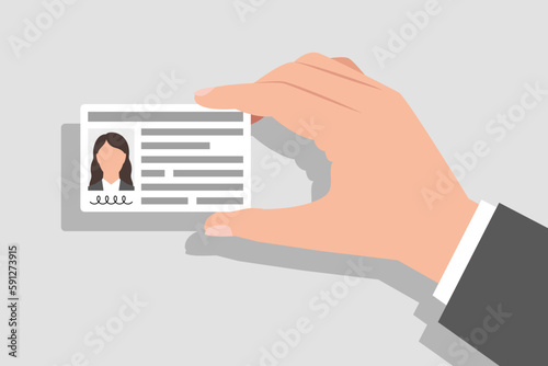 Identity card with personal information in hand of woman