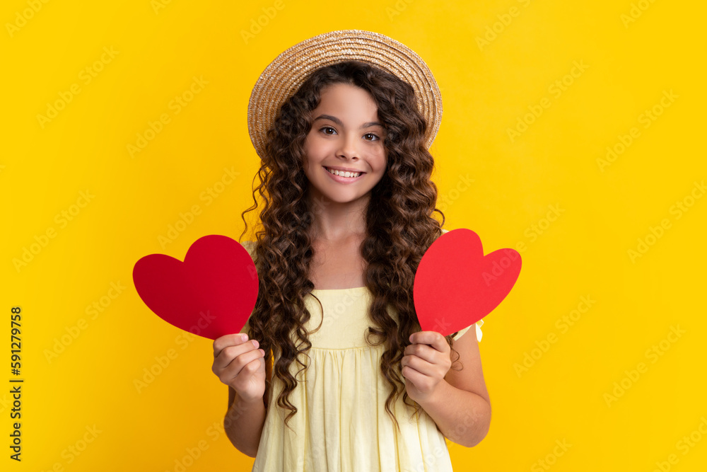 Young teenager child girl with heart shape. Happy Valentines Day. Love and pleasant feelings concept. Happy teenager, positive and smiling emotions of teen girl. Young teenager child girl with heart shape. Happy Valentines Day. Love and pleasant feelings concept. Happy teenager, positive and smiling emotions of teen girl.