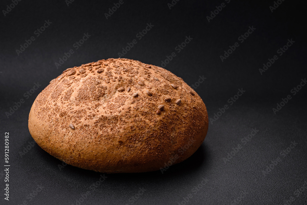Fresh crispy brown bread with sesame seeds and spices Fresh crispy brown bread with sesame seeds and spices