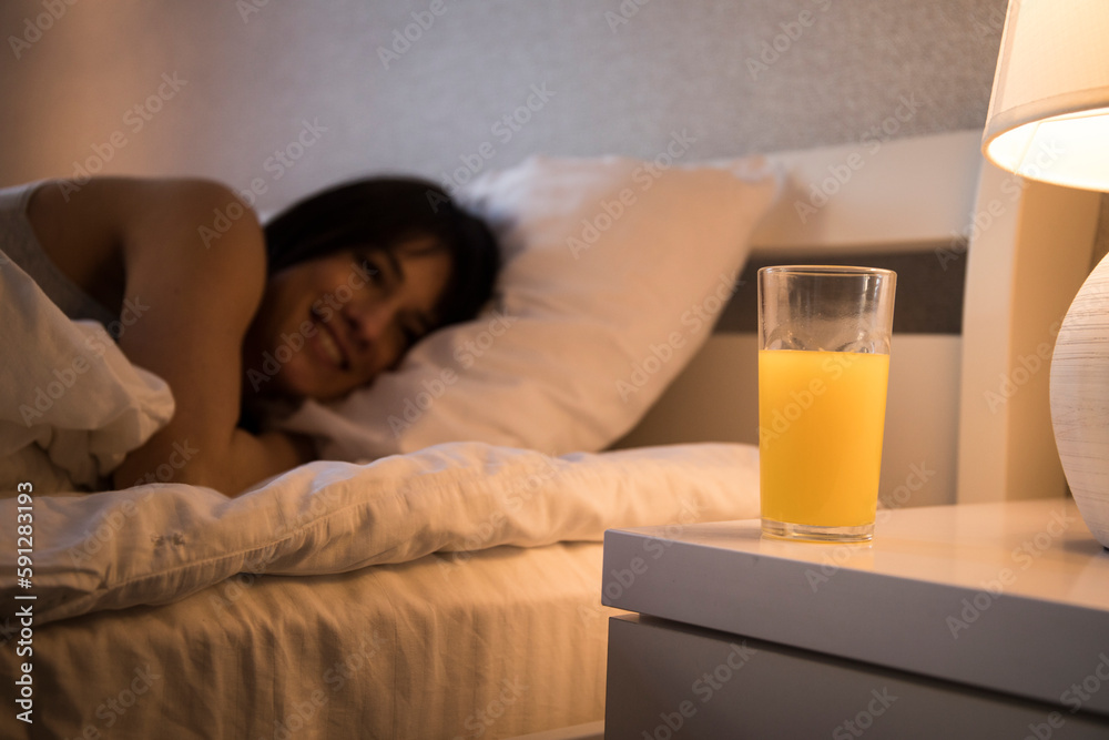 Young woman drinking healthy juice in kitchen. Diet concept
Young woman drinking healthy juice in kitchen. Diet concept