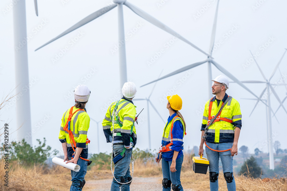 Maintenance engineer man working in wind turbine farm,Wind turbine operations that transform wind energy into electrical electricity,Clean energy concept saves the world. Maintenance engineer man working in wind turbine farm,Wind turbine operations that transform wind energy into electrical electricity,Clean energy concept saves the world.