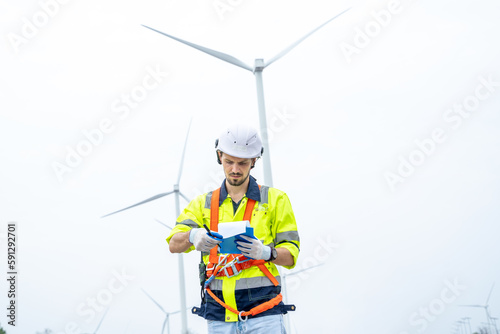 Maintenance engineer man working in wind turbine farm,Wind turbine operations that transform wind energy into electrical electricity,Clean energy concept saves the world.