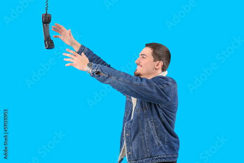 Young man trying to reach f...