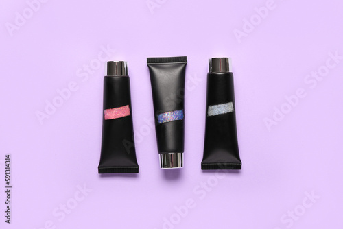 Three black cosmetic tubes ...