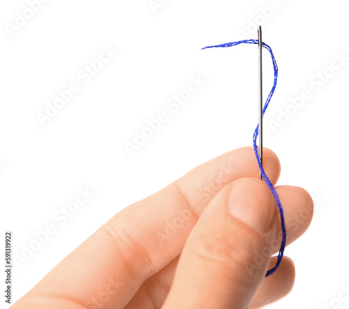 Woman holding sewing needle with thread on white background, closeup