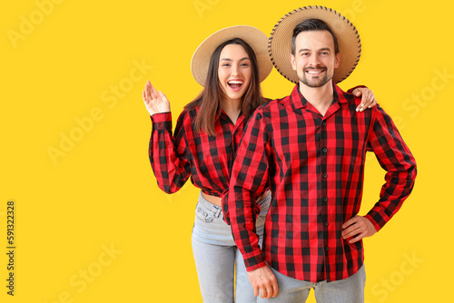 Happy young couple on yello...