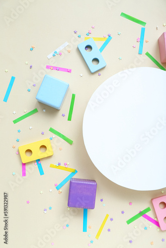 Blank card with baby blocks and confetti on beige background. Children's Day celebration