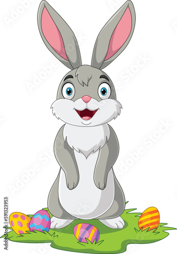 Cute little bunny with Easter egg in the grass