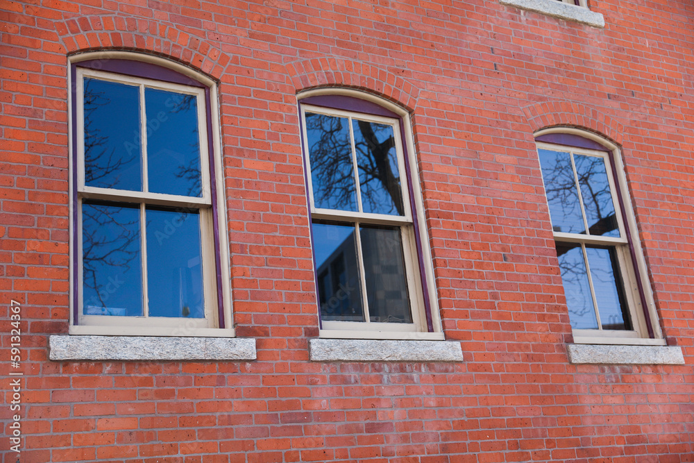 city brick buildings can symbolize urbanization, industrialization, and modernity, representing stability and endurance, while the cityscape suggests a bustling and dynamic environment