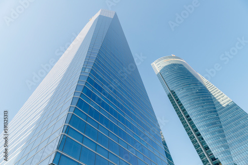 Cuatro Torres Business Area in Madrid with blue sky, spain